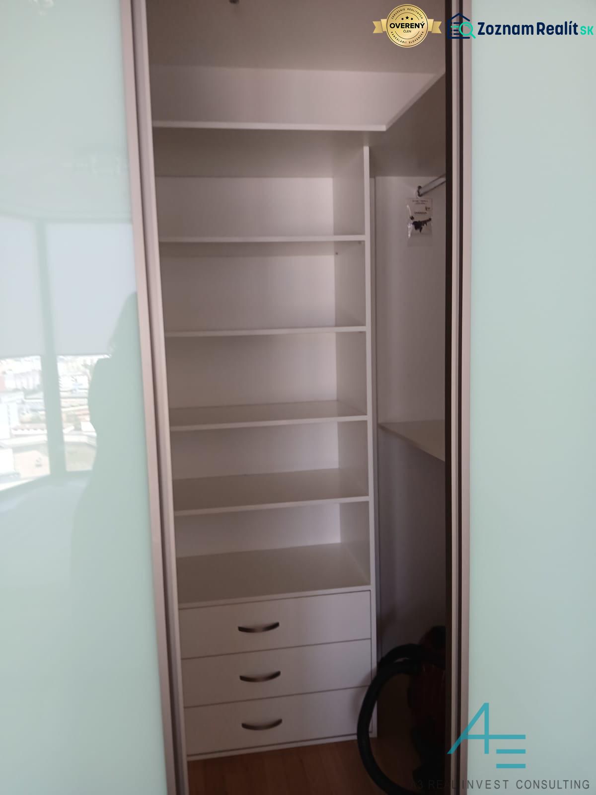 Built-in wardrobe with shelves and drawers in a 2-room apartment.