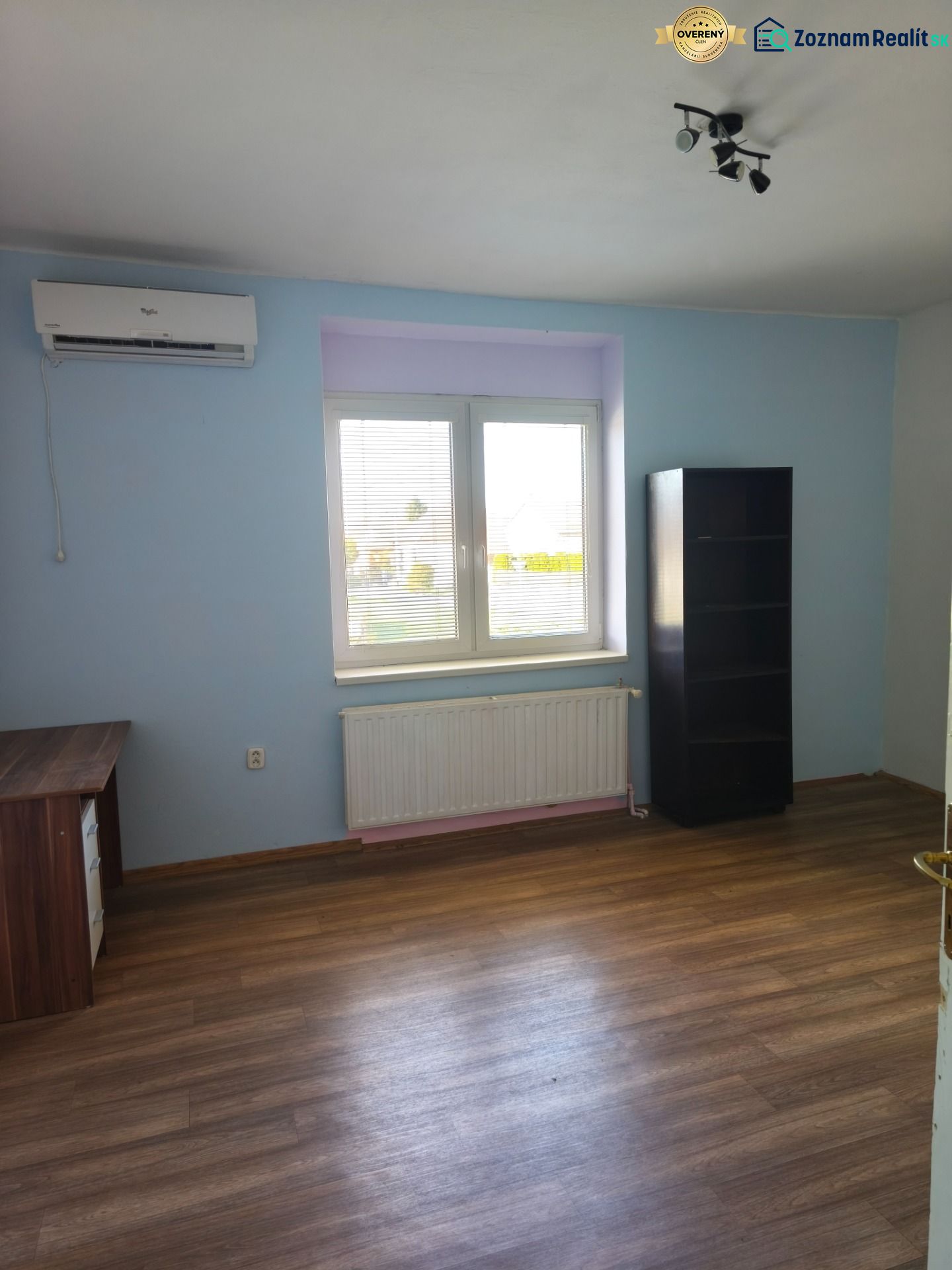 A room in a family house with a wooden decor floor and furniture.