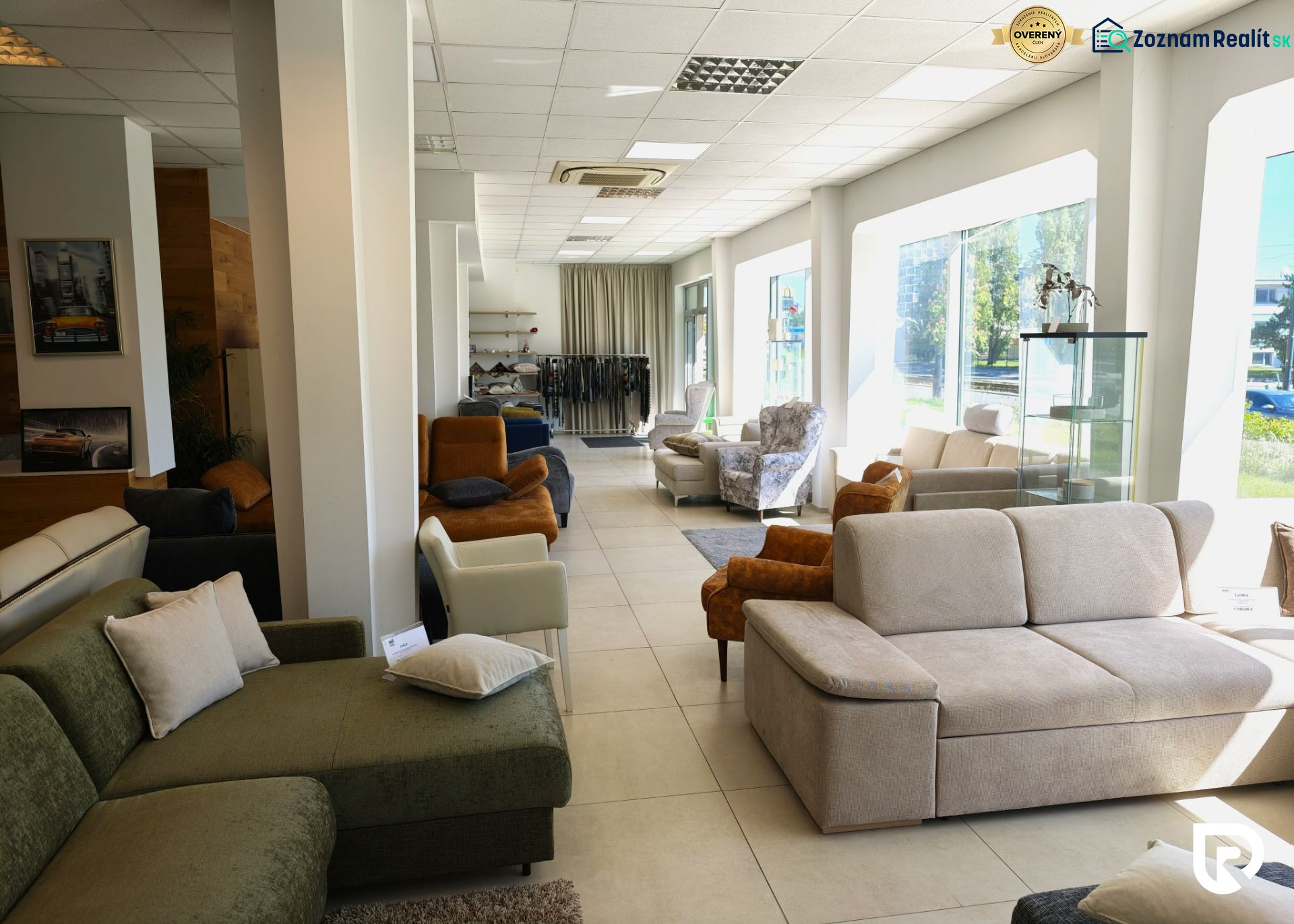 Comfortable sofas and armchairs in commercial spaces with large windows and fabric samples.