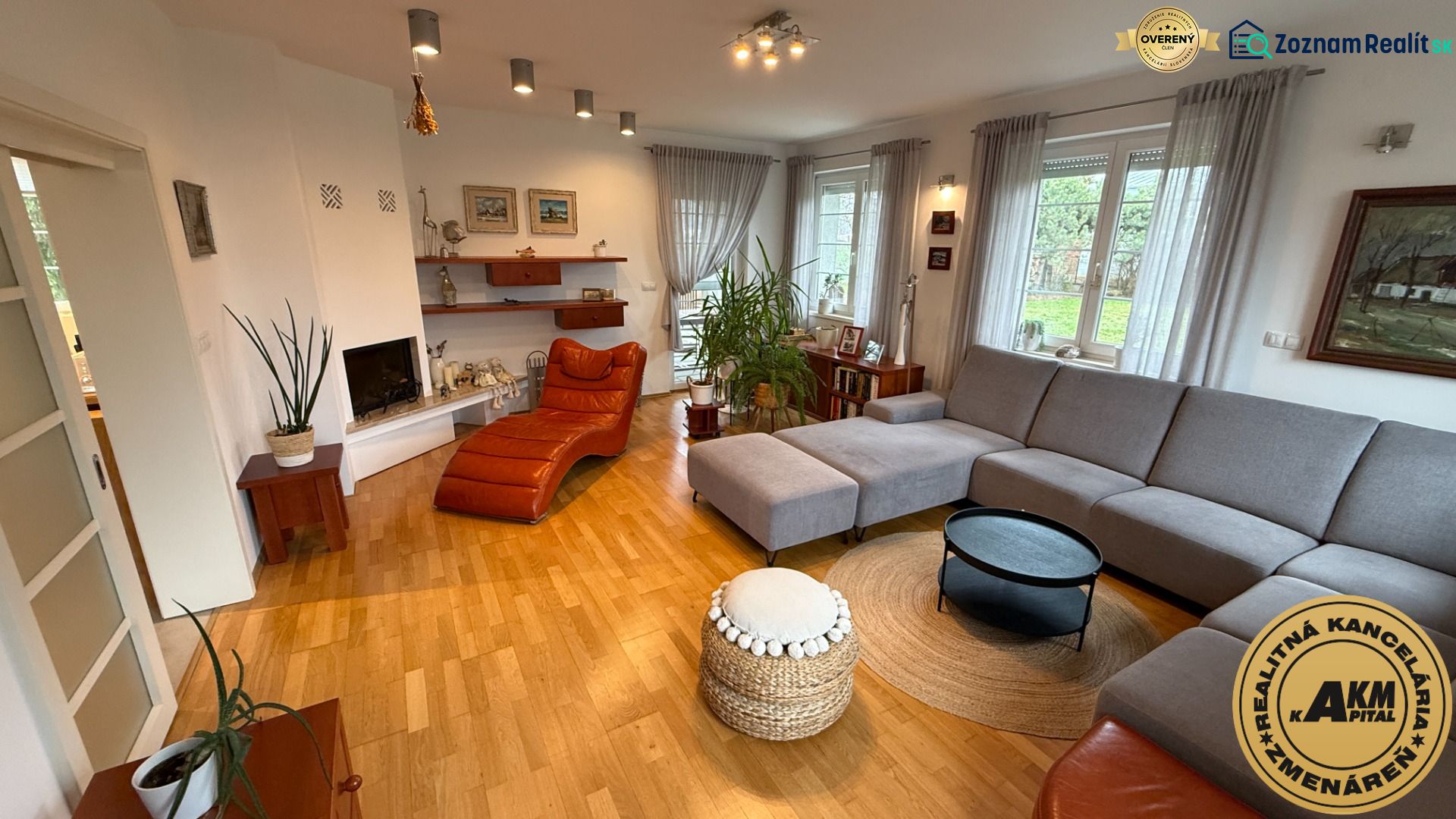 Living room in a family house with a comfortable corner sofa and a floor with a wood decor.