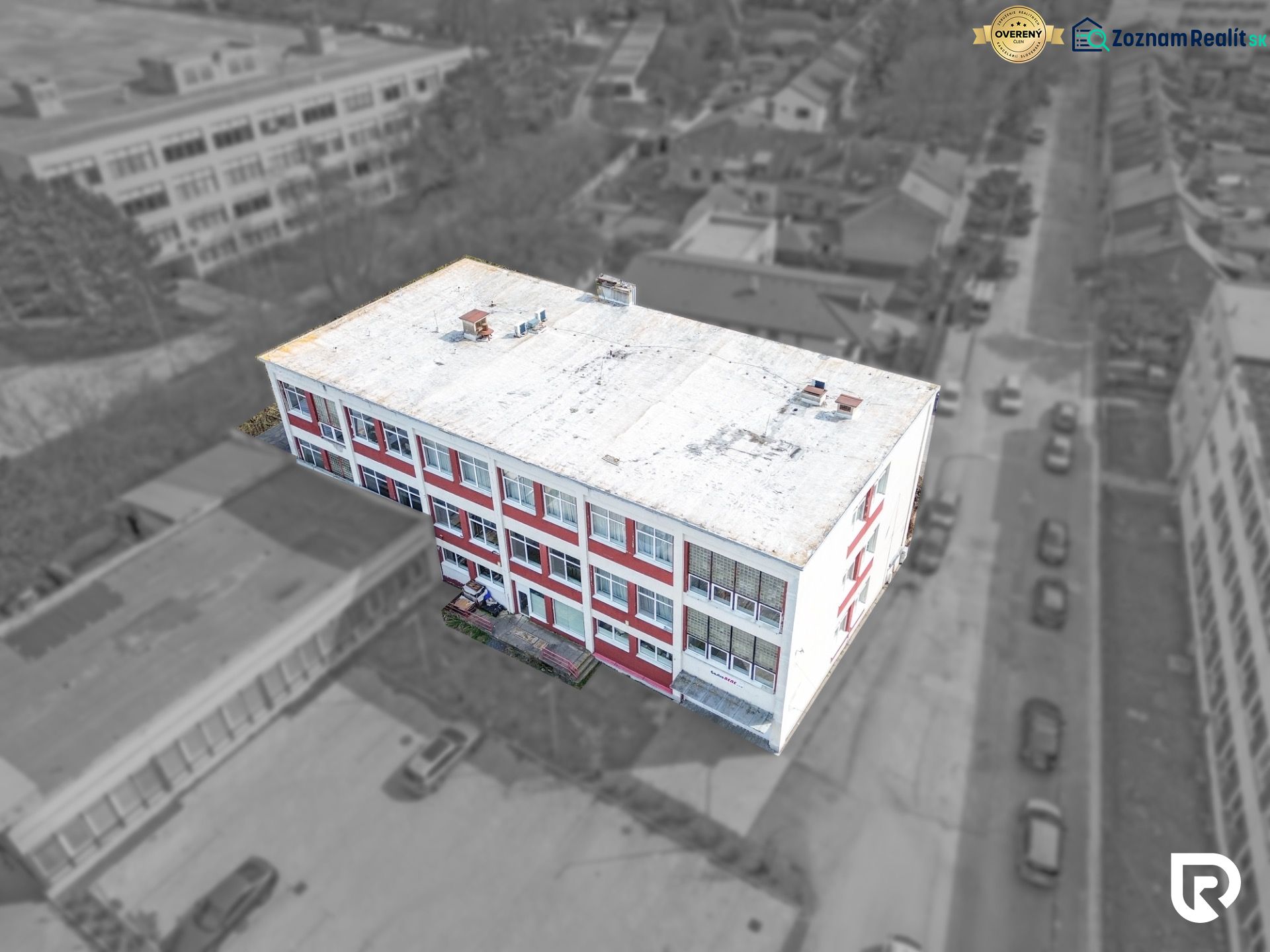 A building on Jána Zigmundíka Street in the town of Vrbové with commercial spaces.