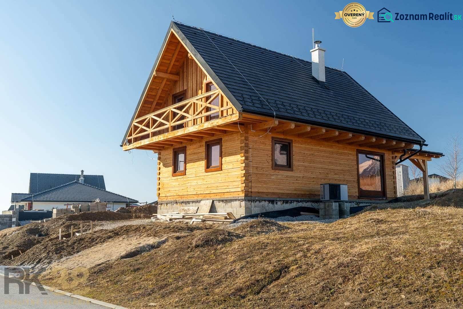 A family house in Stará Lesná with a wooden facade and a sloped roof.