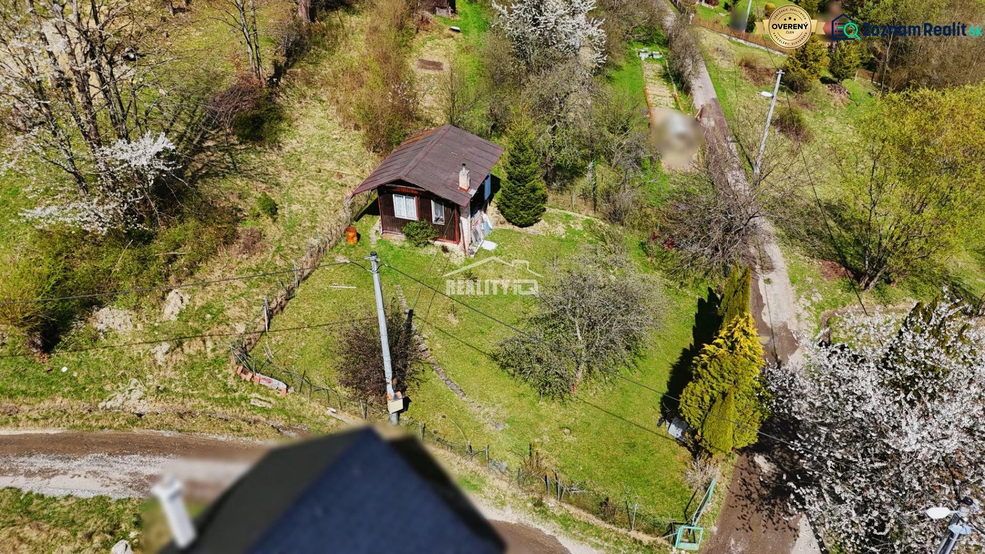 A wooden cottage surrounded by trees and nature in Krásno nad Kysucou.