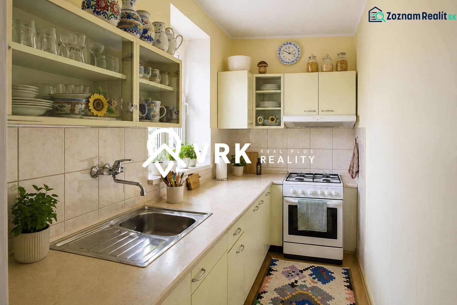 A kitchen in a family house with a gas stove, cabinets, and decorative elements.