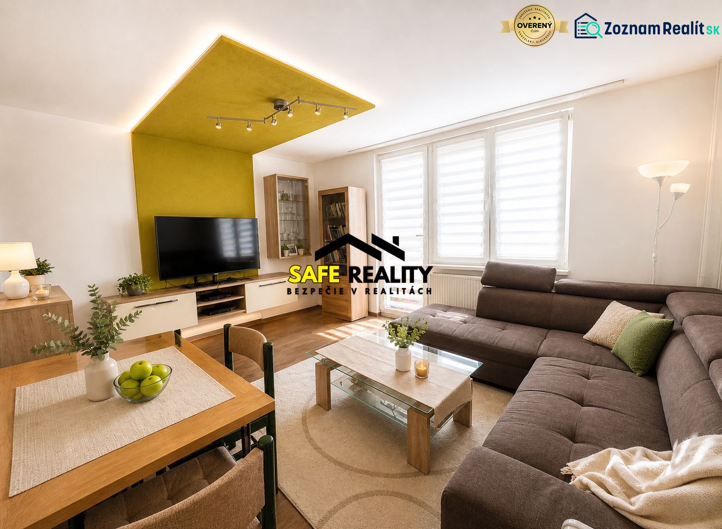 Spacious living room in a 3-room apartment with a corner sofa and a television.