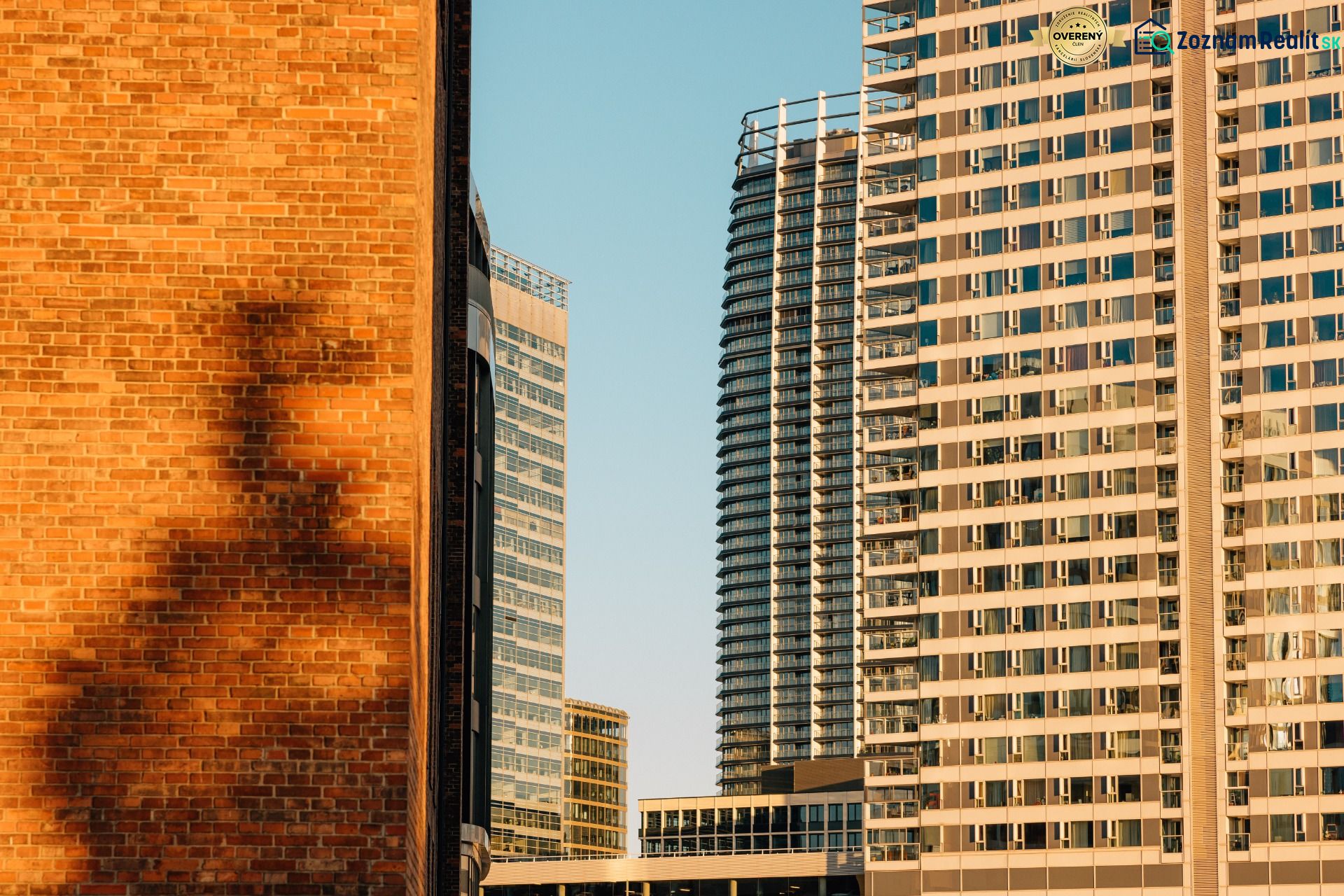 High-rise buildings with glass facades in Bratislava - Ružinov at sunset.