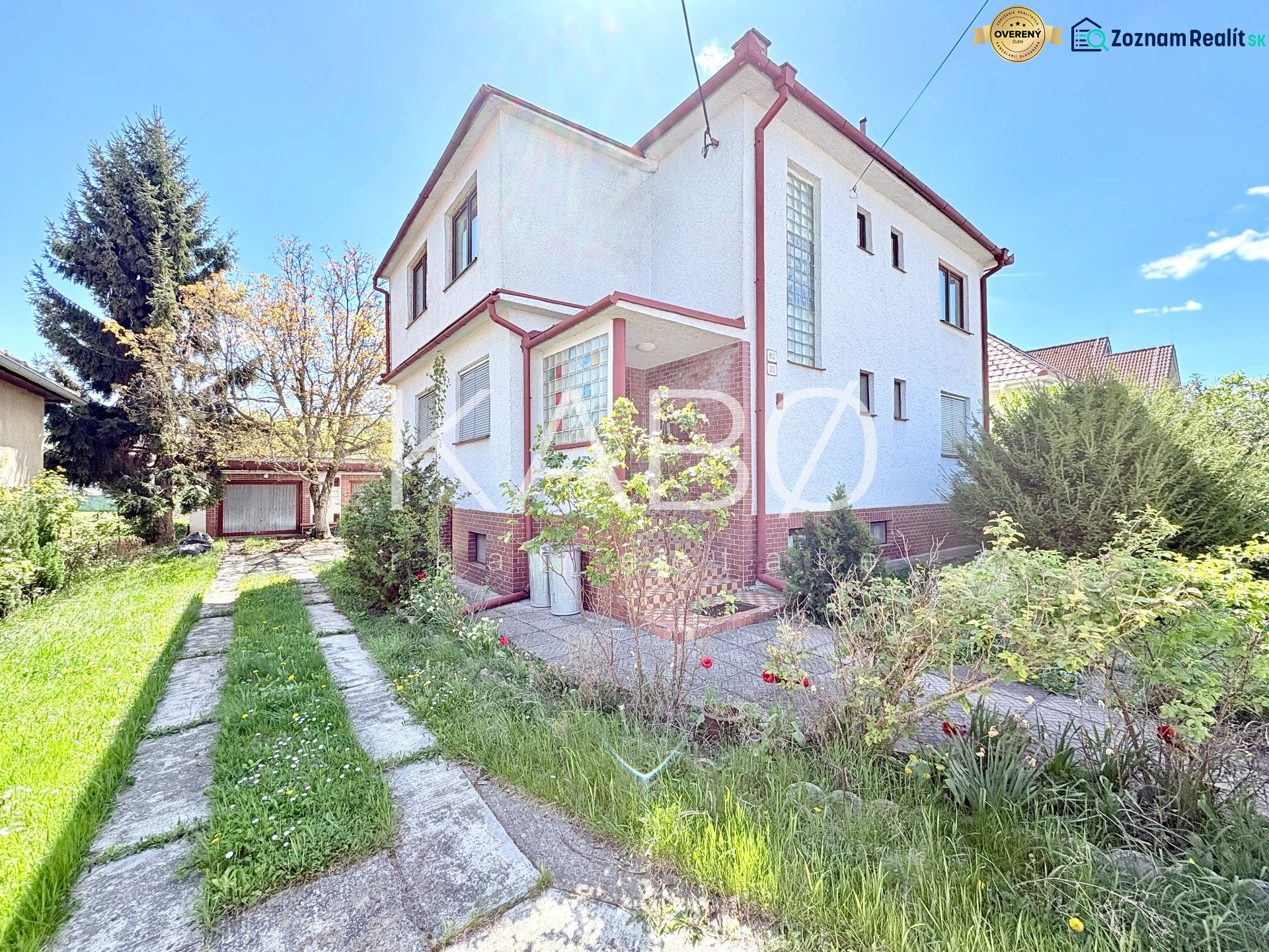 A family house on Puškinova Street in Partizánske with a garden and a driveway.