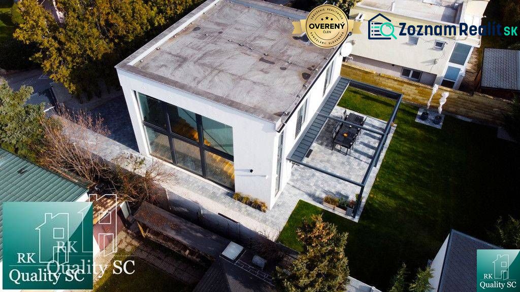 A family house at Sunny Lakes South in Senec with large windows and a terrace.