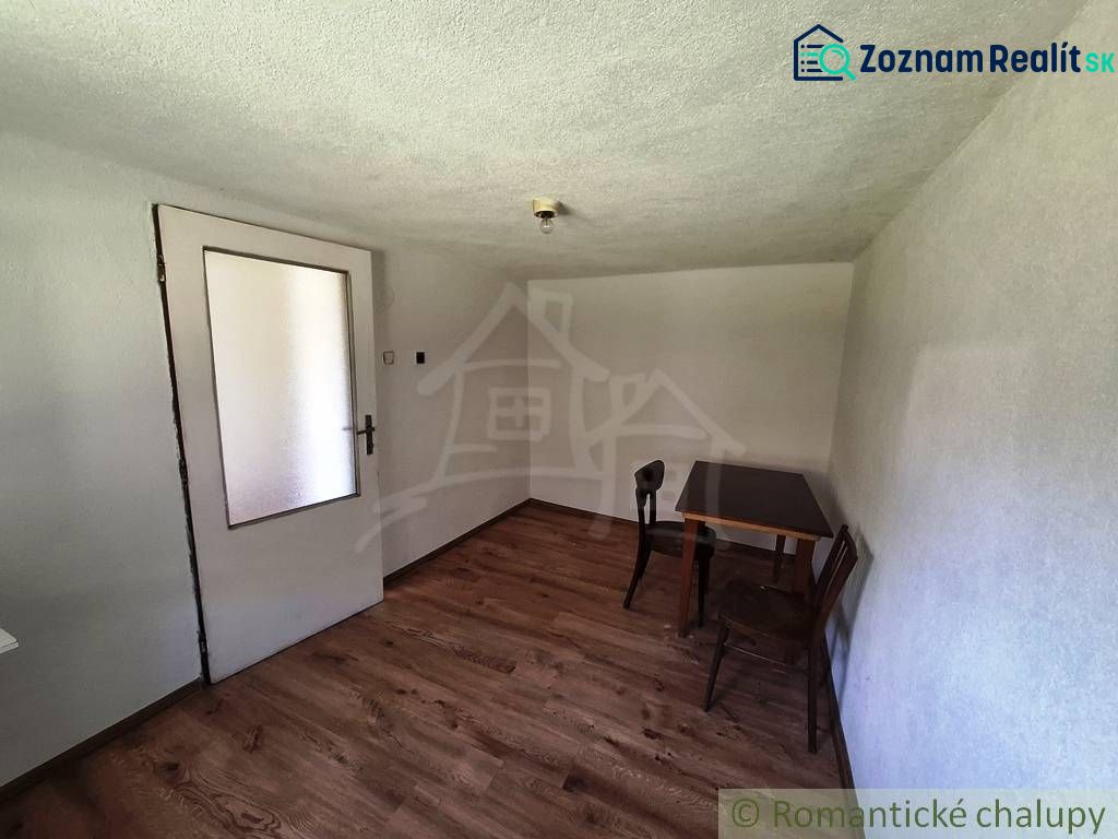 A simple room in a family house with wooden decor flooring.