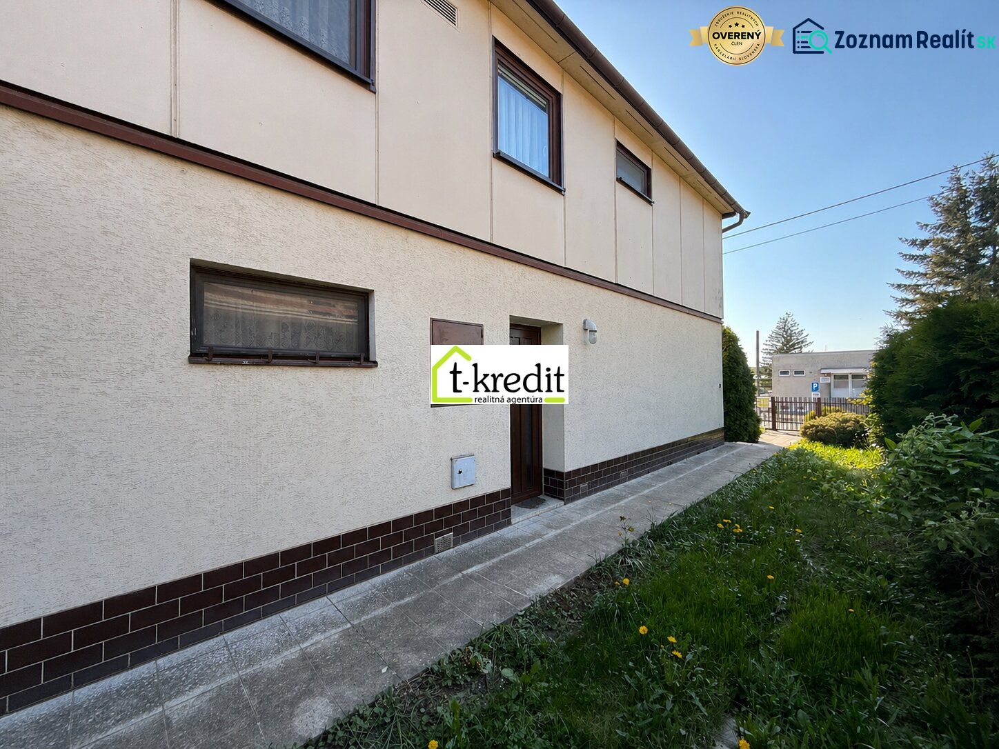 A family house in Zlaté Moravce with a lawn and a driveway.