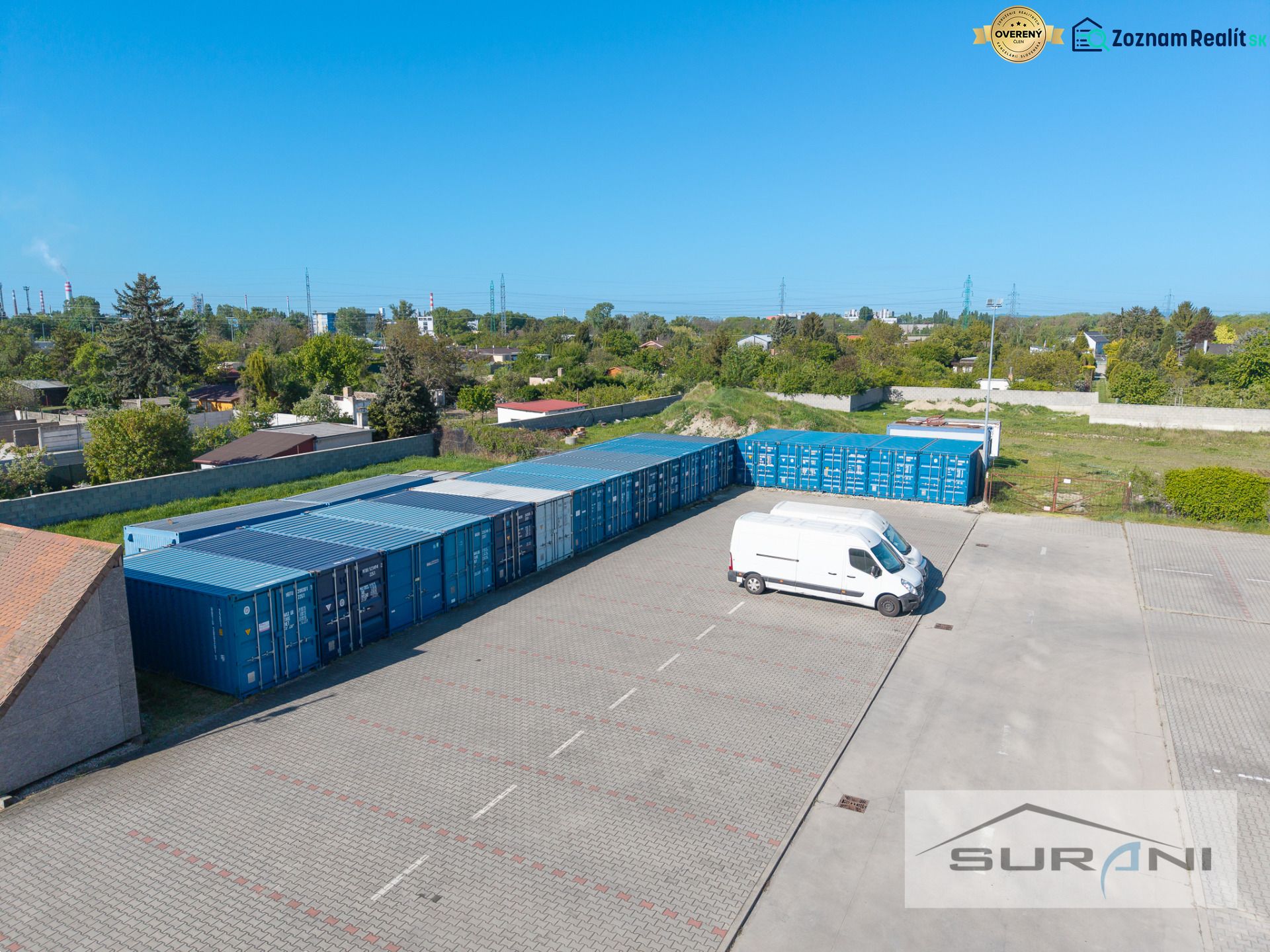 Parking lot with a van and containers in Bratislava - Podunajské Biskupice on Svornosti Street.