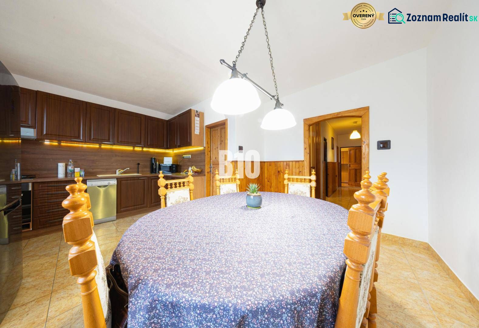 A dining room in a family house with wooden decor and a decorated table.