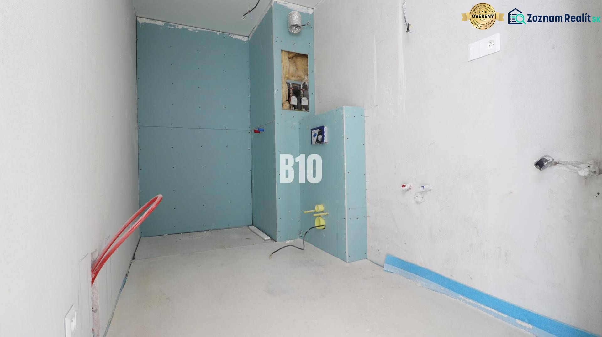 The interior of a 3-room apartment with an unfinished bathroom featuring installations and drywall.
