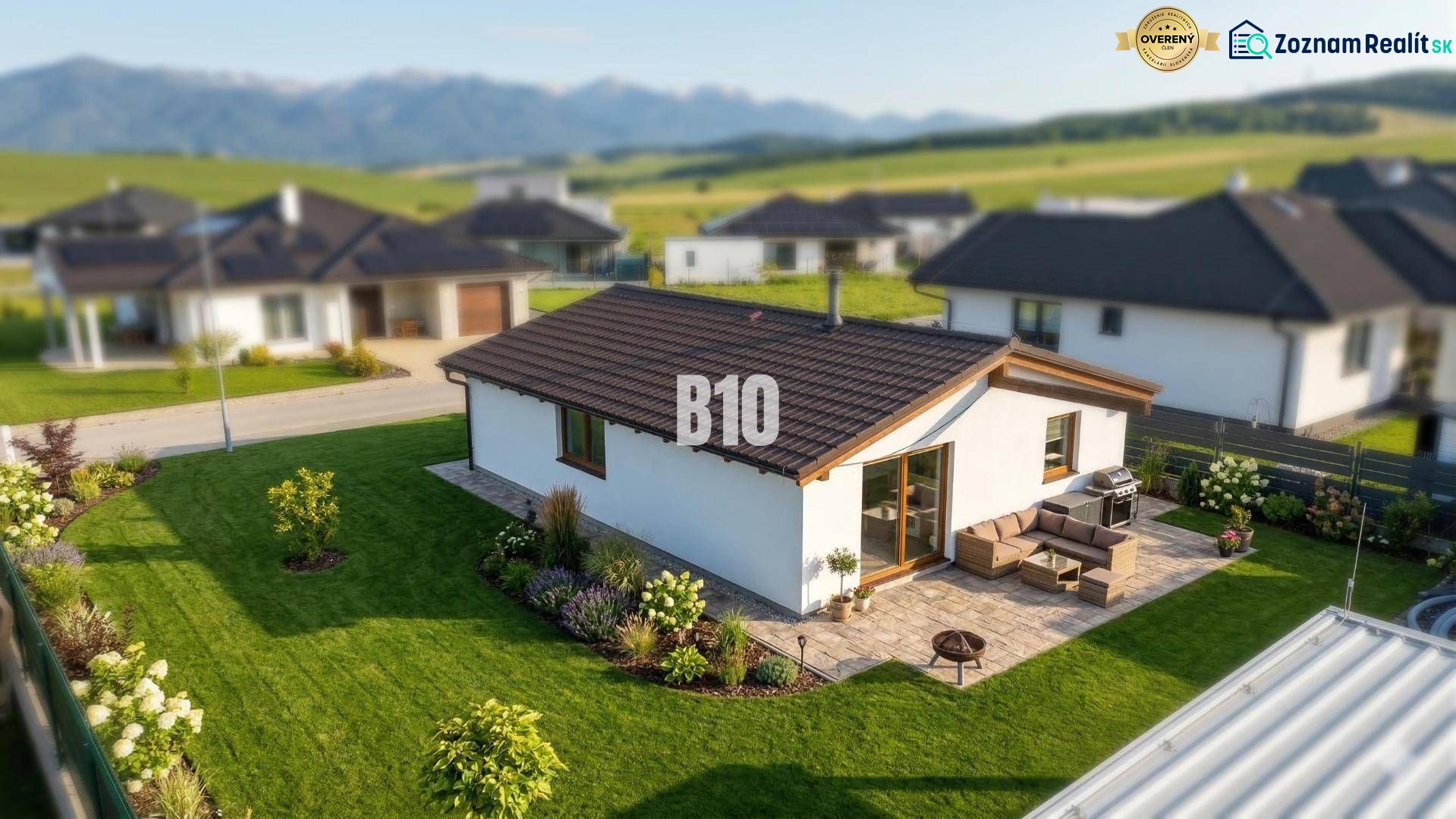 A family house in Diaková with a large garden and terrace, with mountains in the background.