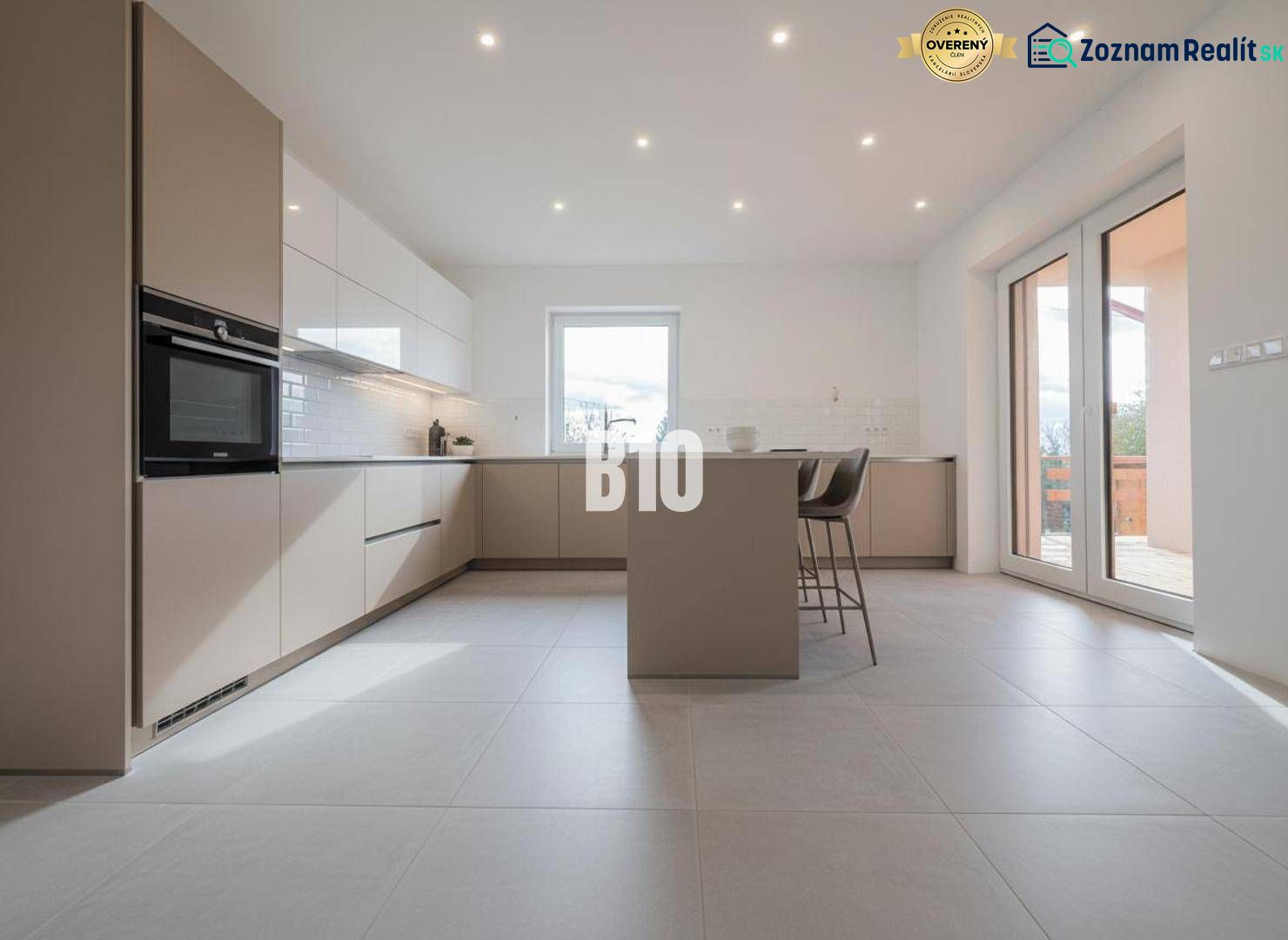 Kitchen in a family house with an island and bar stools.