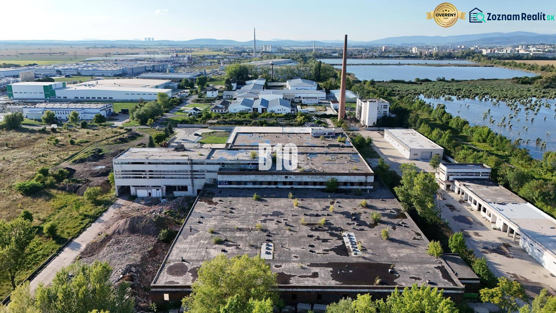 Production facilities in Levice surrounded by greenery and an industrial zone.
