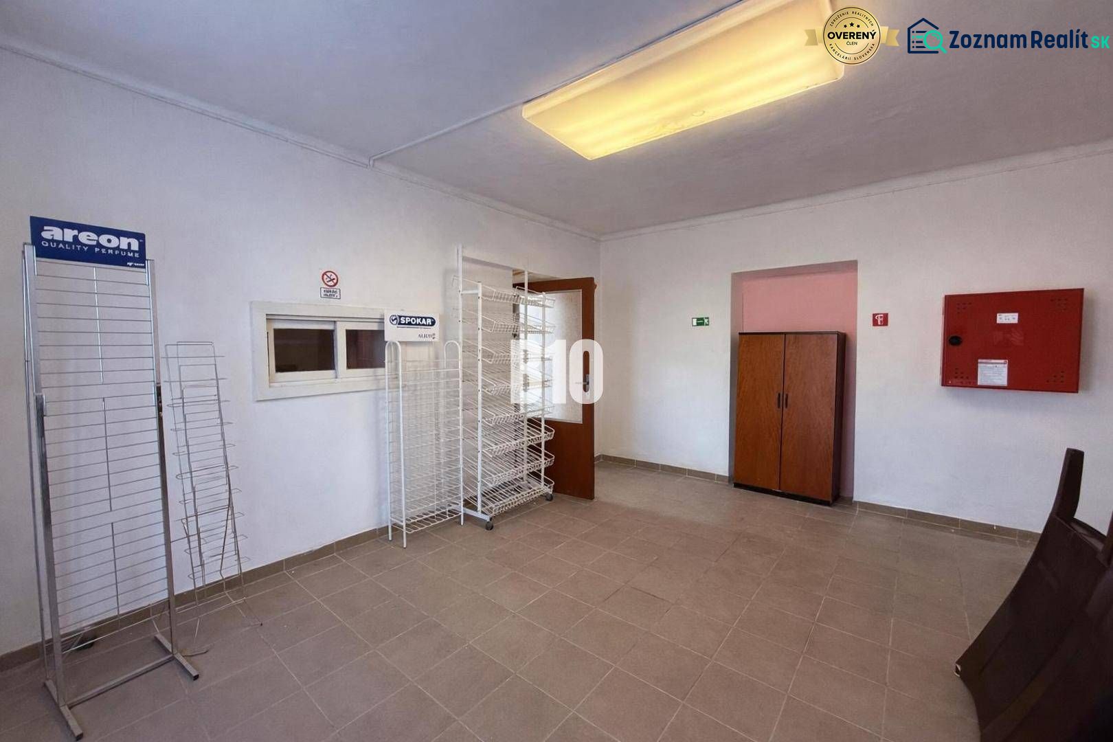 Commercial spaces with empty shelves and storage cabinets.