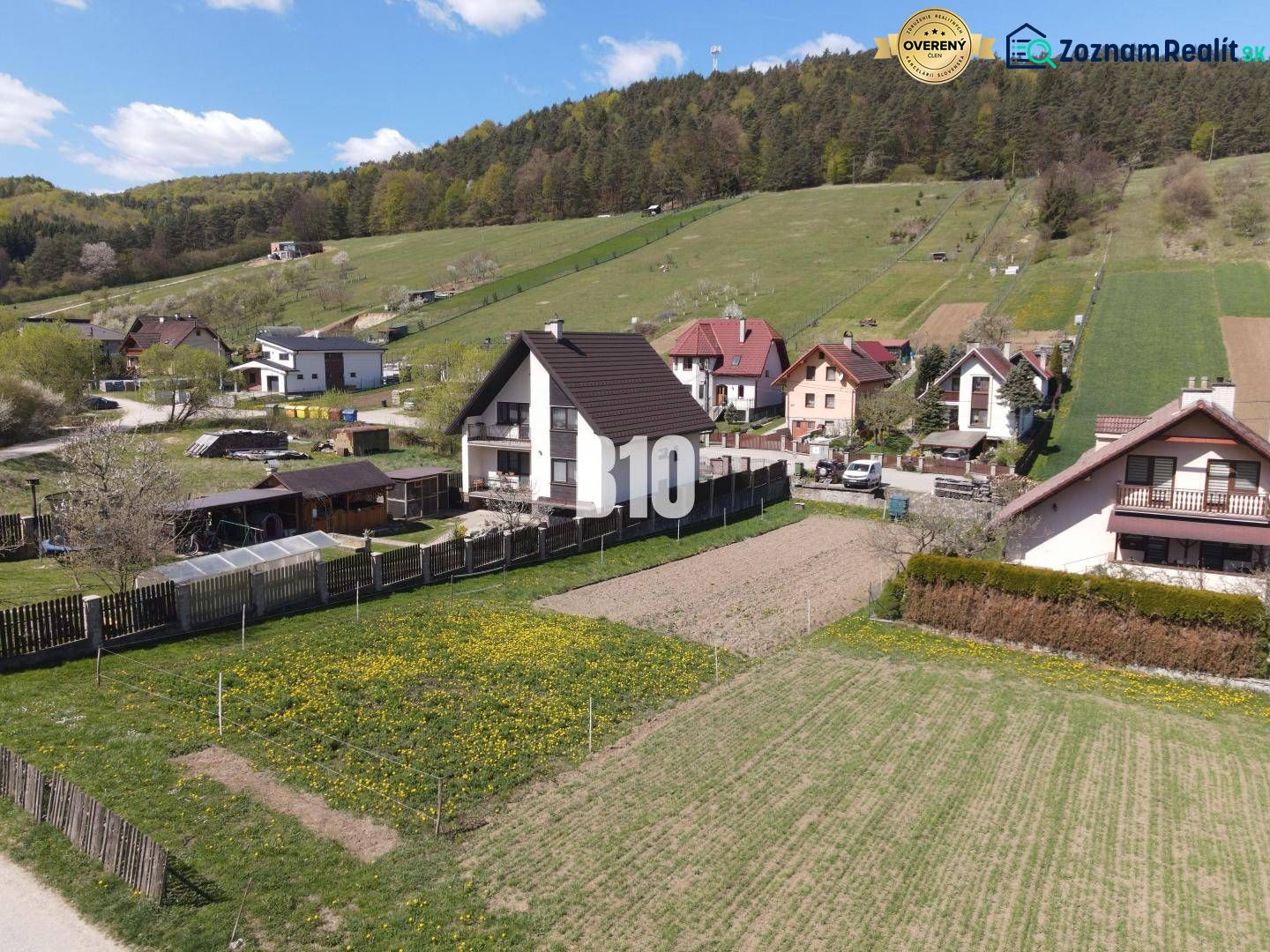Hilly terrain with houses and gardens in Bytča on Pozemky - housing.