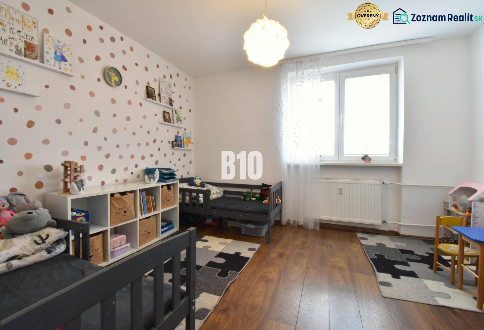 A children's room with a wooden decor floor in a 3-room apartment.