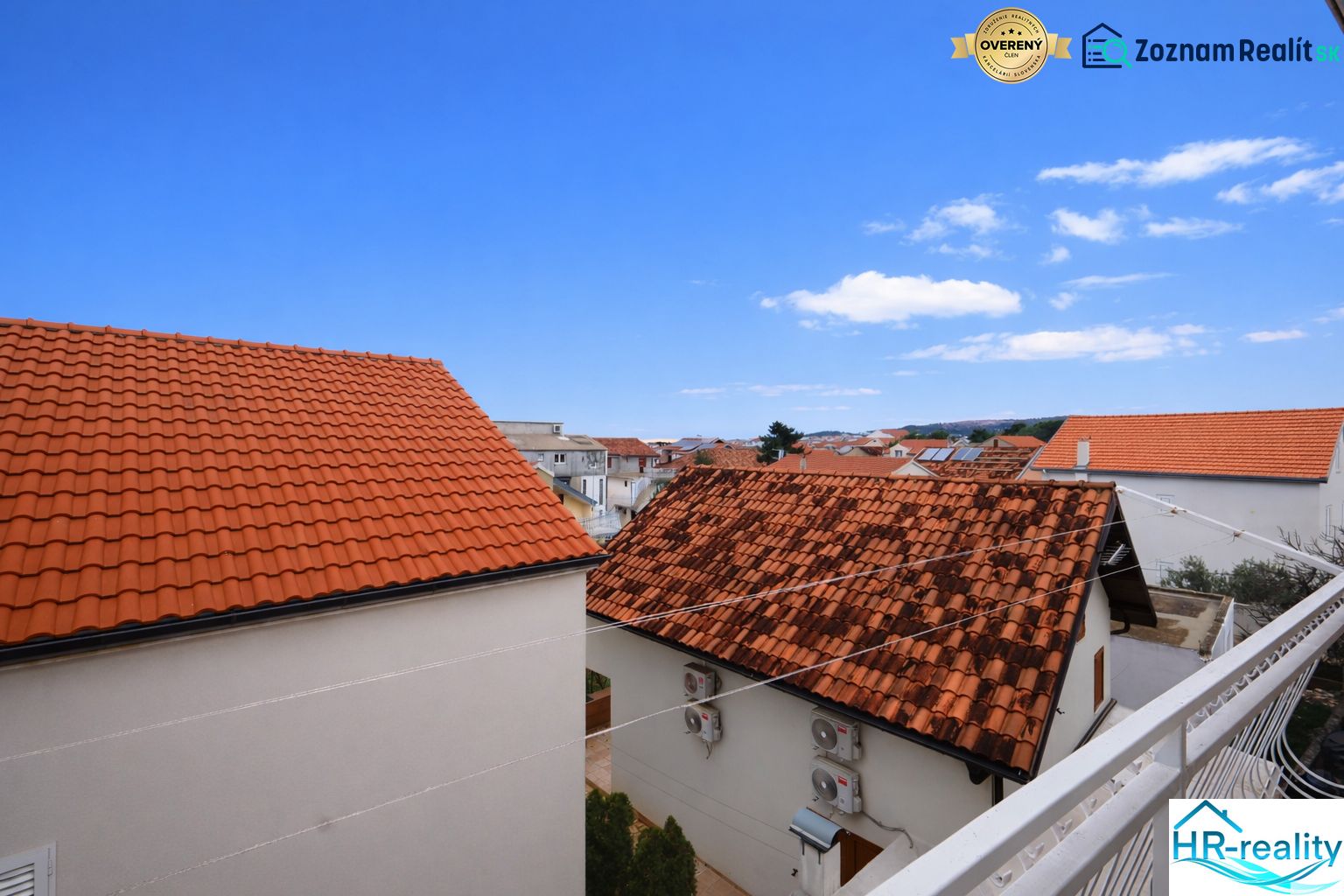 A view of rooftops and the blue sky from a holiday apartment in Vodice.
