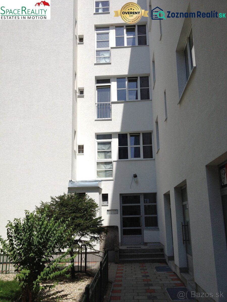 The facade of an apartment building with a garden in Bratislava - Nové Mesto on Vajnorská Street.