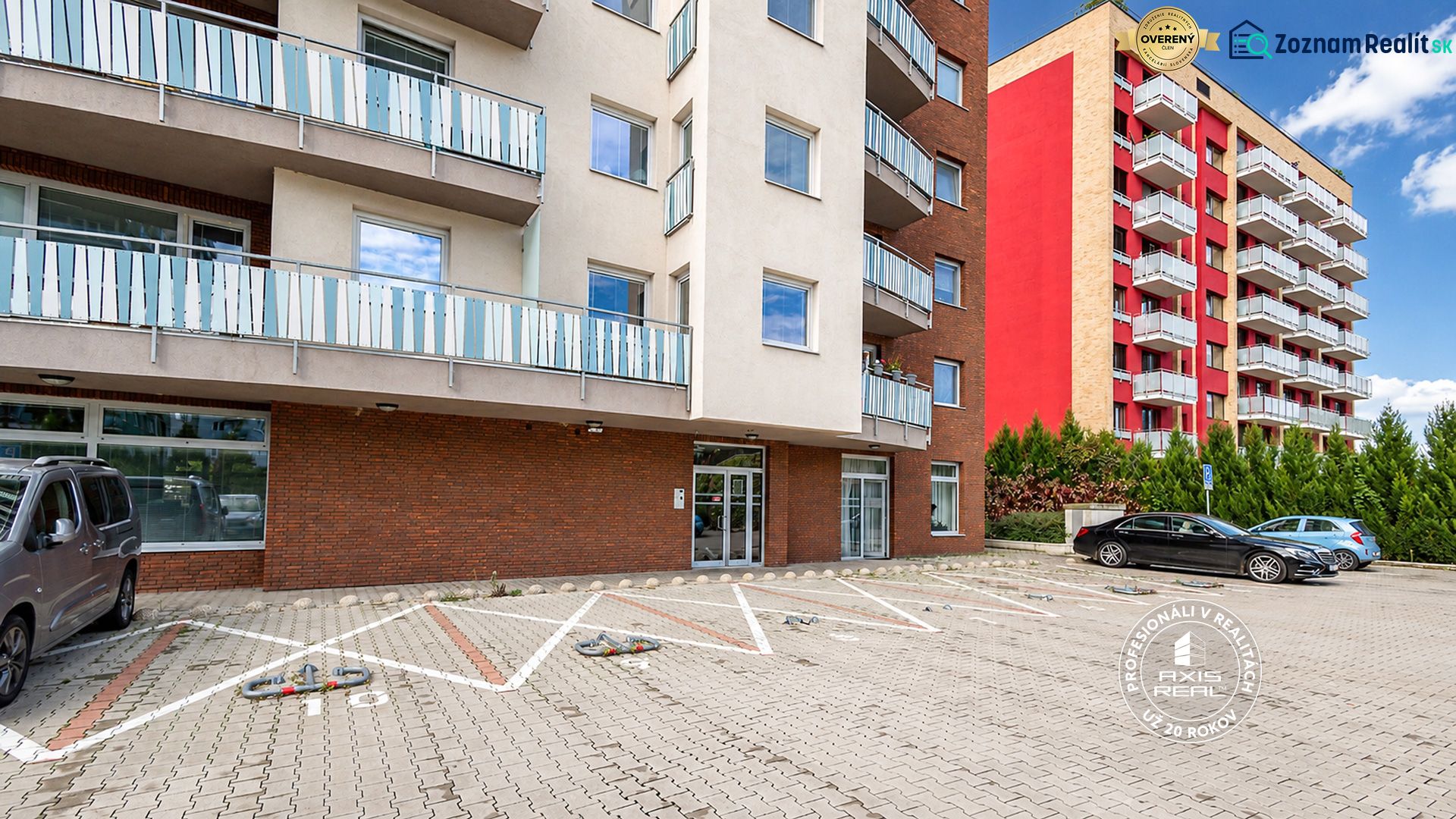 Garages on Bosákova Street in Bratislava - Petržalka in front of apartment buildings with balconies.