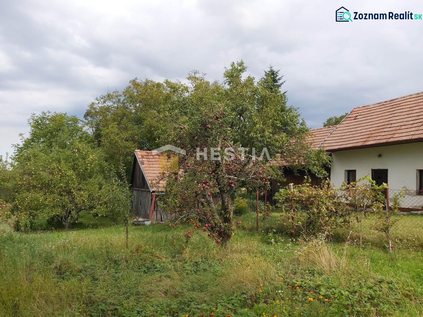 A family house surrounded by greenery in Cerová on a plot designated for residential use.