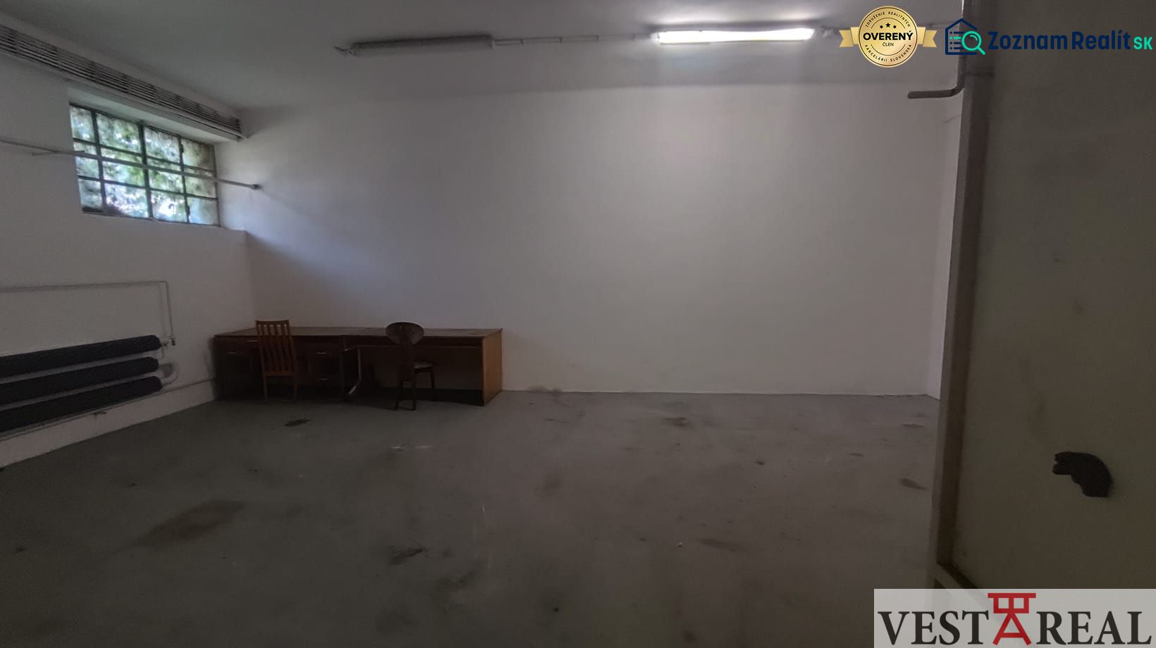Spacious room with a desk and chair in Warehouses and Halls.