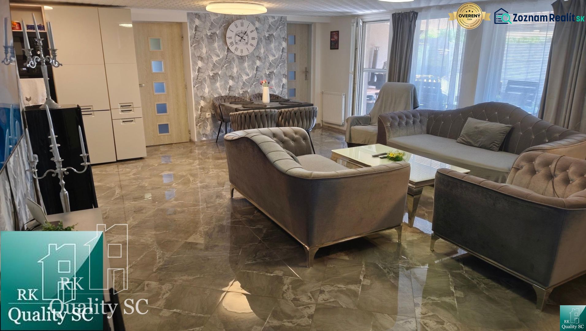 Living room in a family house with a marble floor, comfortable sofa, and decorations.