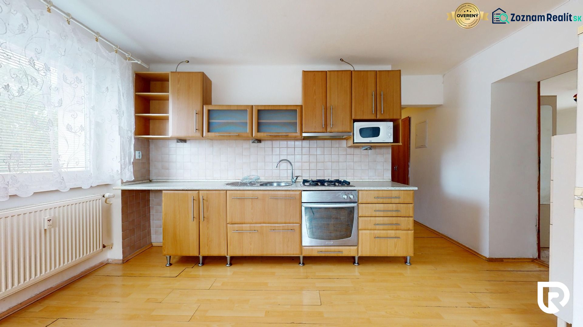 A kitchen in a 3-room apartment with wooden decor and furnishings.
