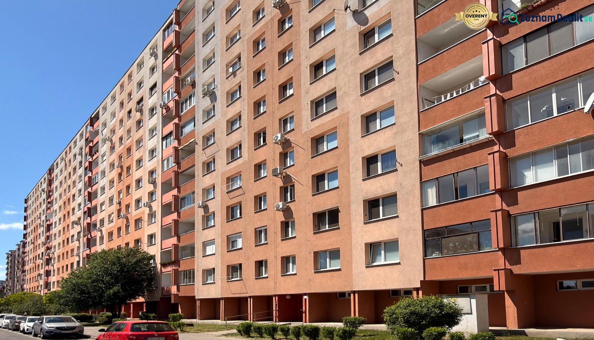 Apartment building on Lachova Street in Petržalka, Bratislava, with parking and greenery.