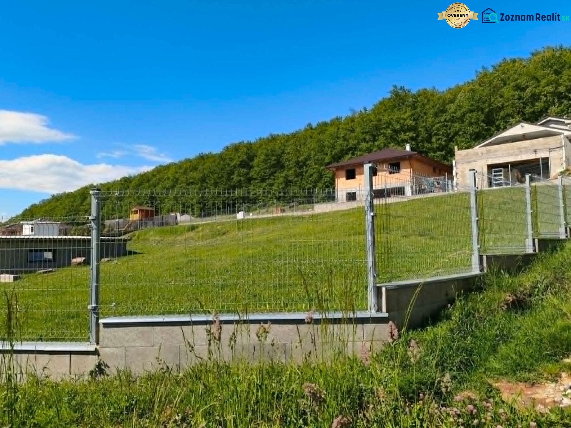 Residential plots in Horná Ves with fencing and views of the surrounding forests.