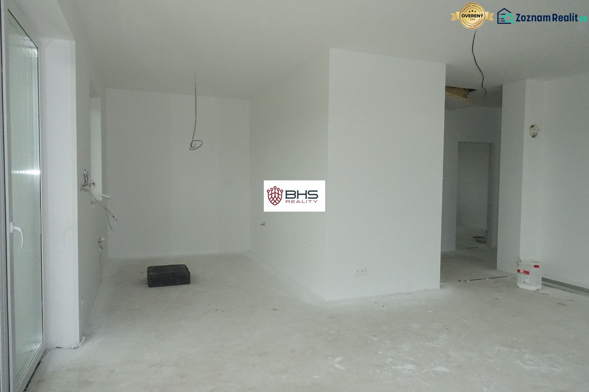 Interior of a family house with an empty room and preparation for electrical installation.