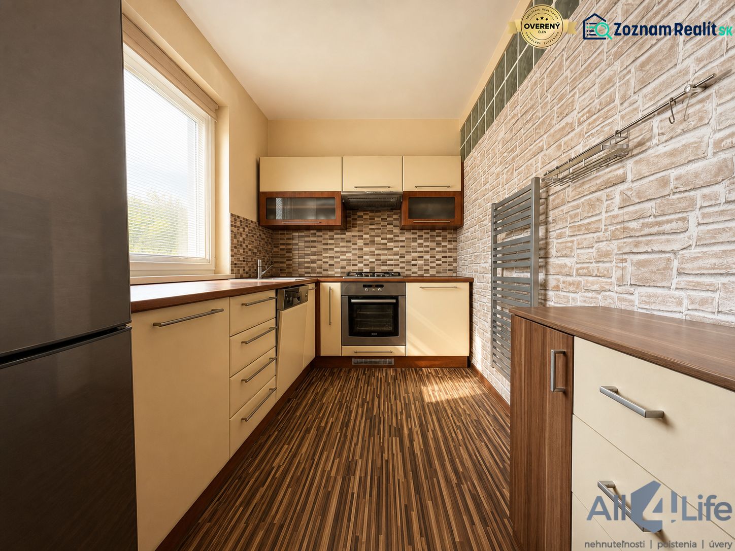 A kitchen in a 3-room apartment with a wooden decor floor and stylish surfaces.