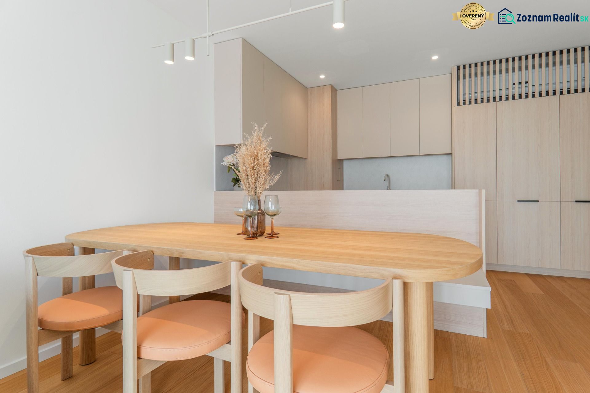 Dining table with chairs in the kitchen, floor with wood decor, 3-room apartment.