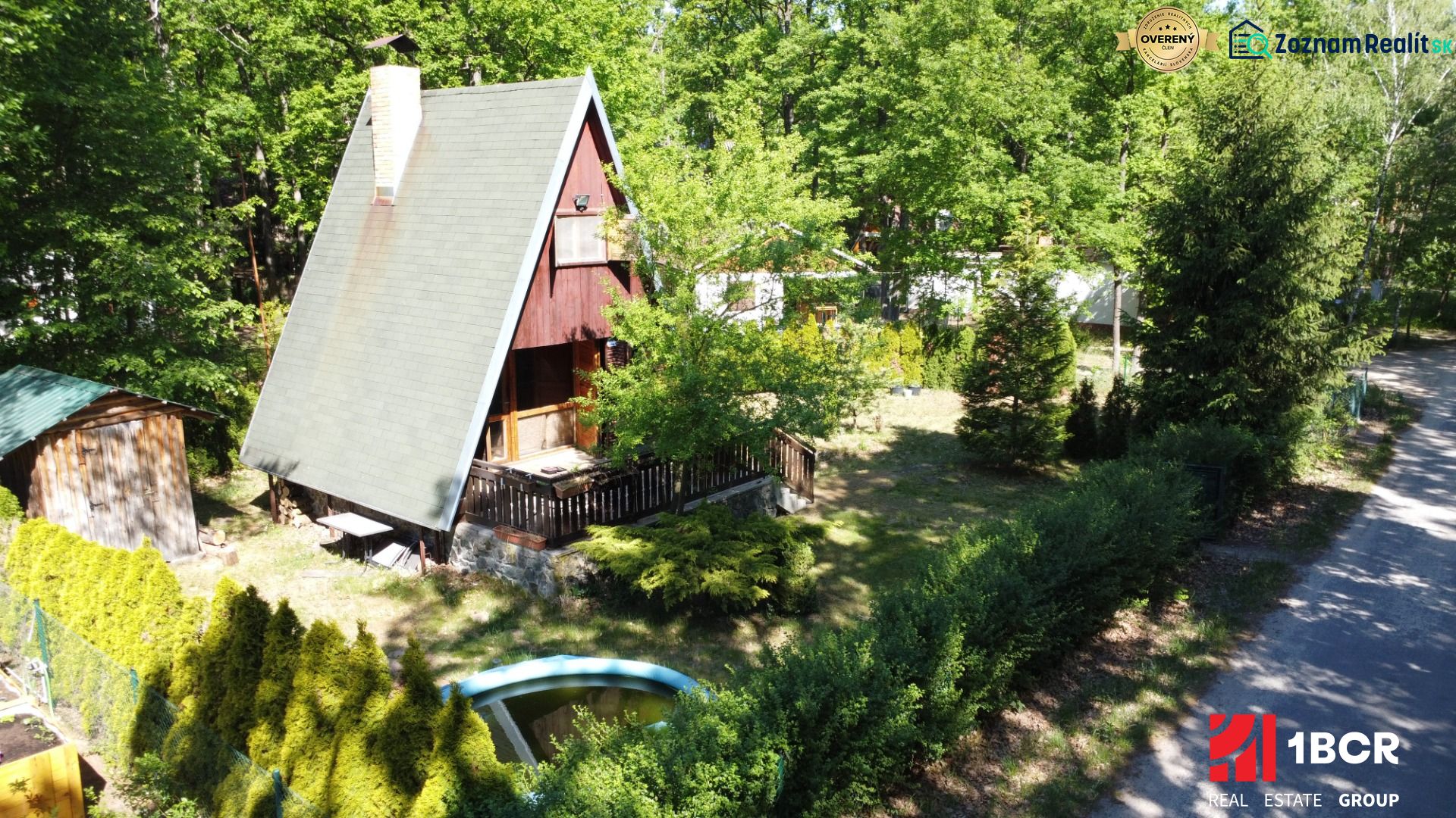 A cottage in Šaštín-Stráže at Do Gazárky surrounded by trees, with a terrace and a swimming pool.