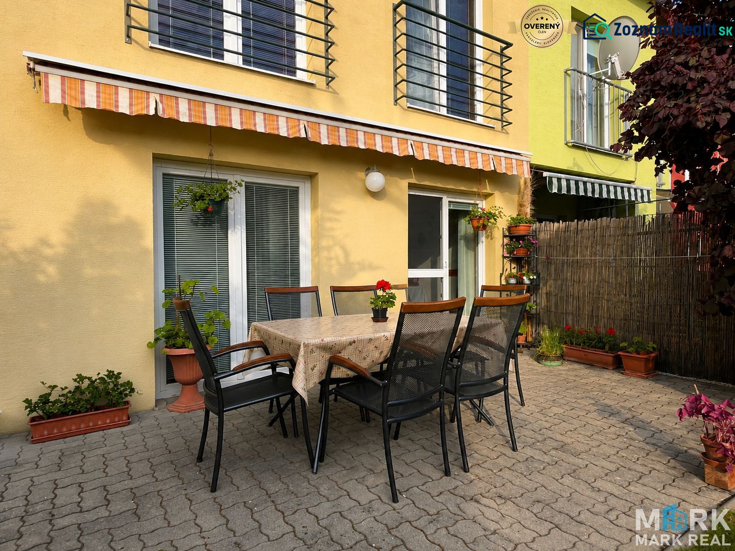 The terrace of a family house on Hrabová Street in Hamuliakovo with outdoor seating and an awning.