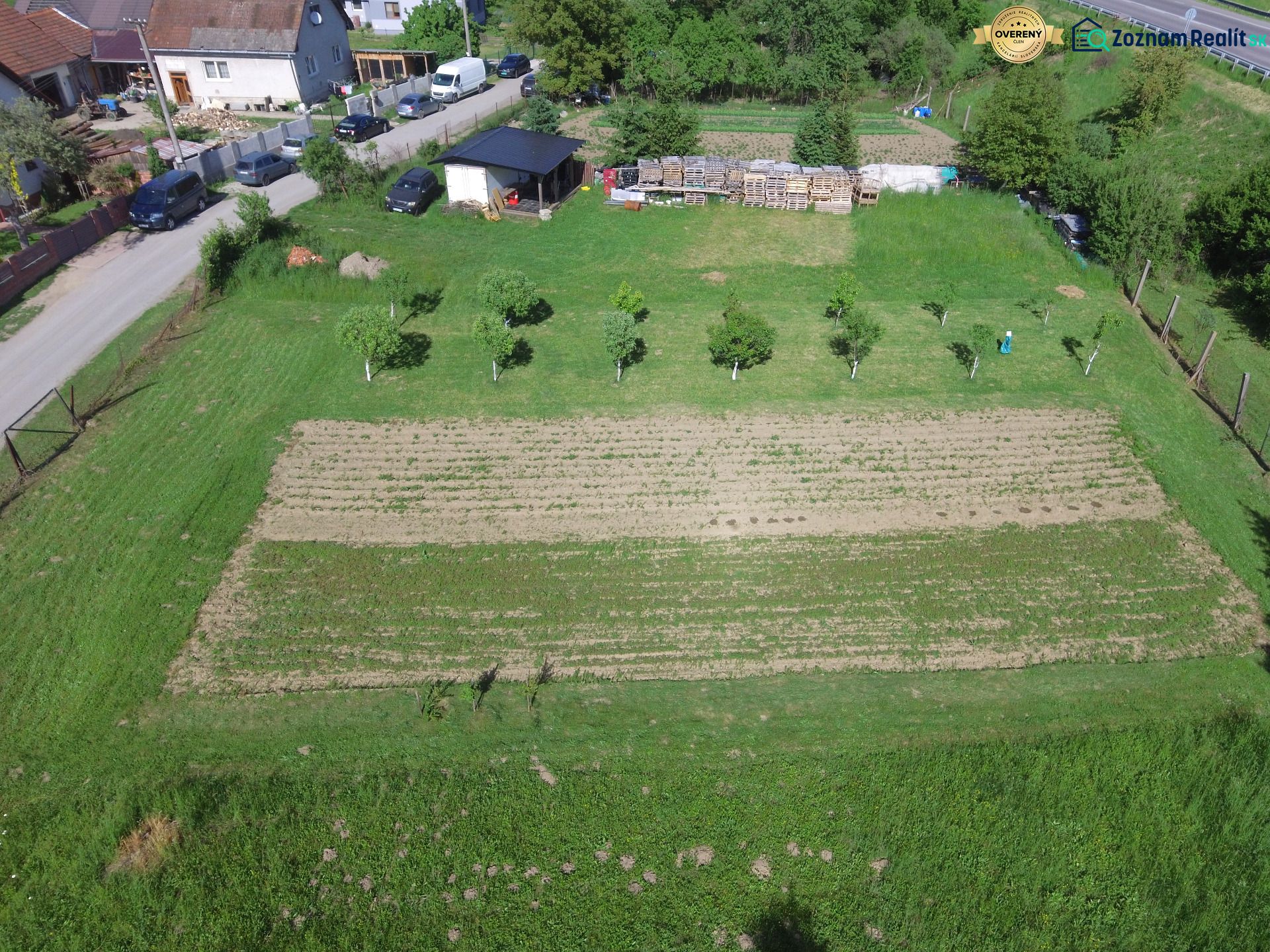 Land on Hlboká Street in Turany suitable for living, planted trees, and a garden.