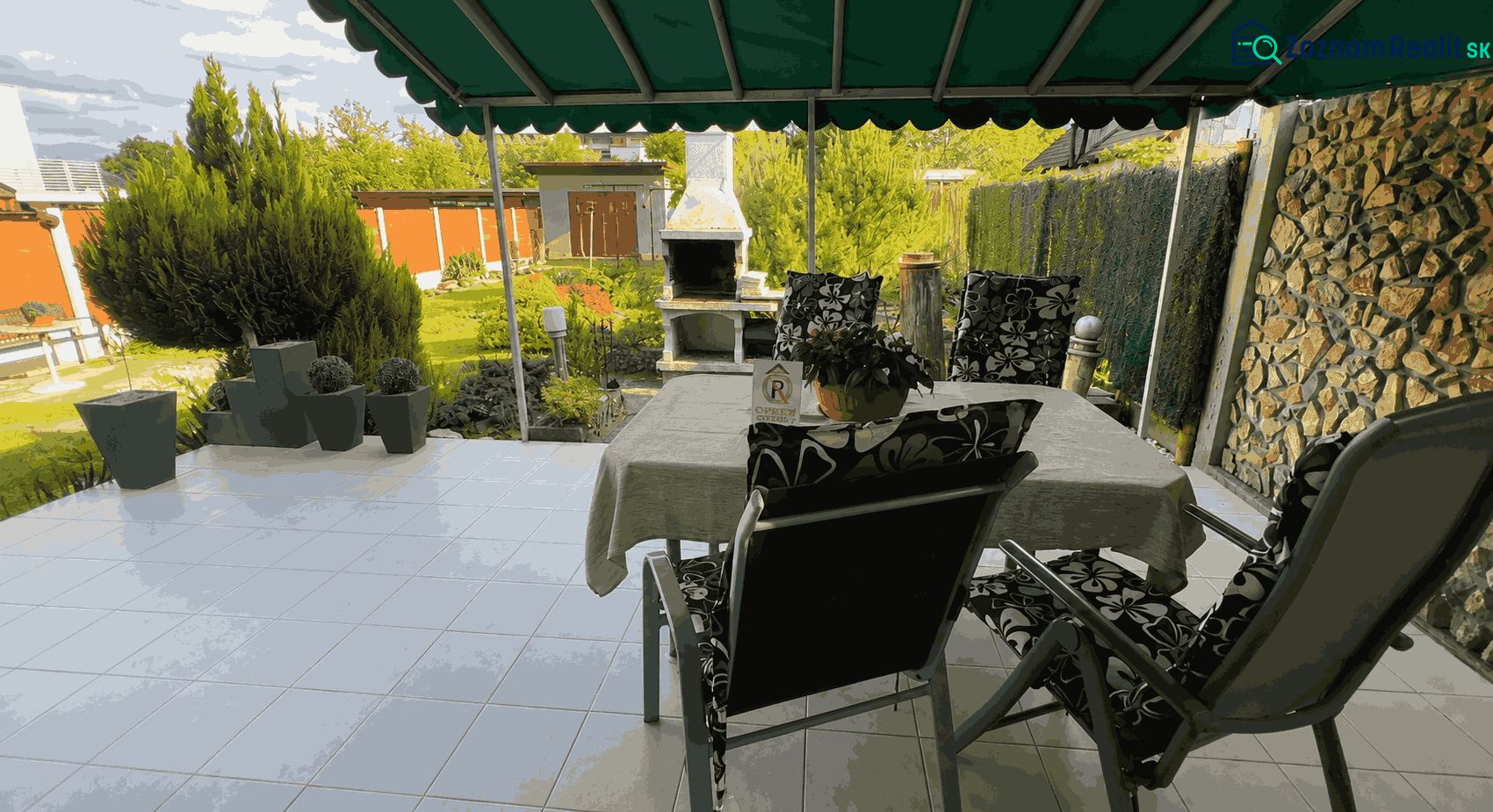 The garden of a family house on Kalvárska Road in Ružomberok with seating and a grill.