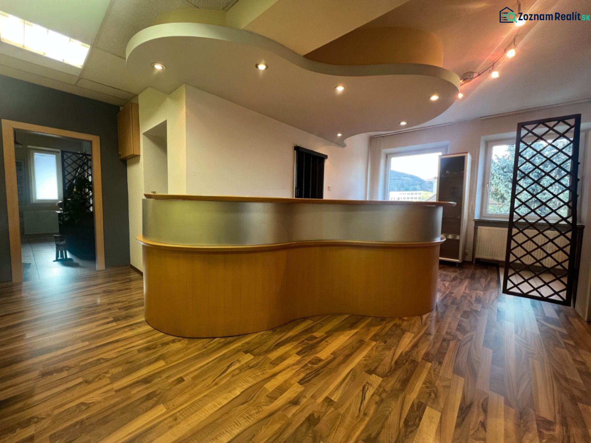 Reception with wooden decor and lighting elements in the production area.