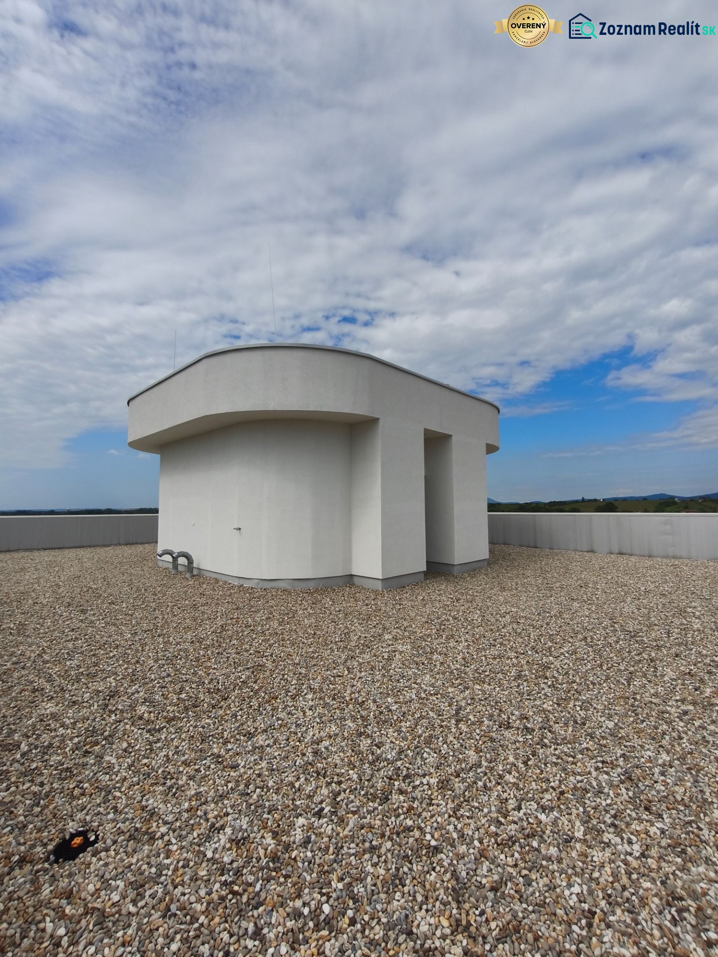 The roof of a building with a gravel surface in Zlaté Moravce on 1. mája Street.