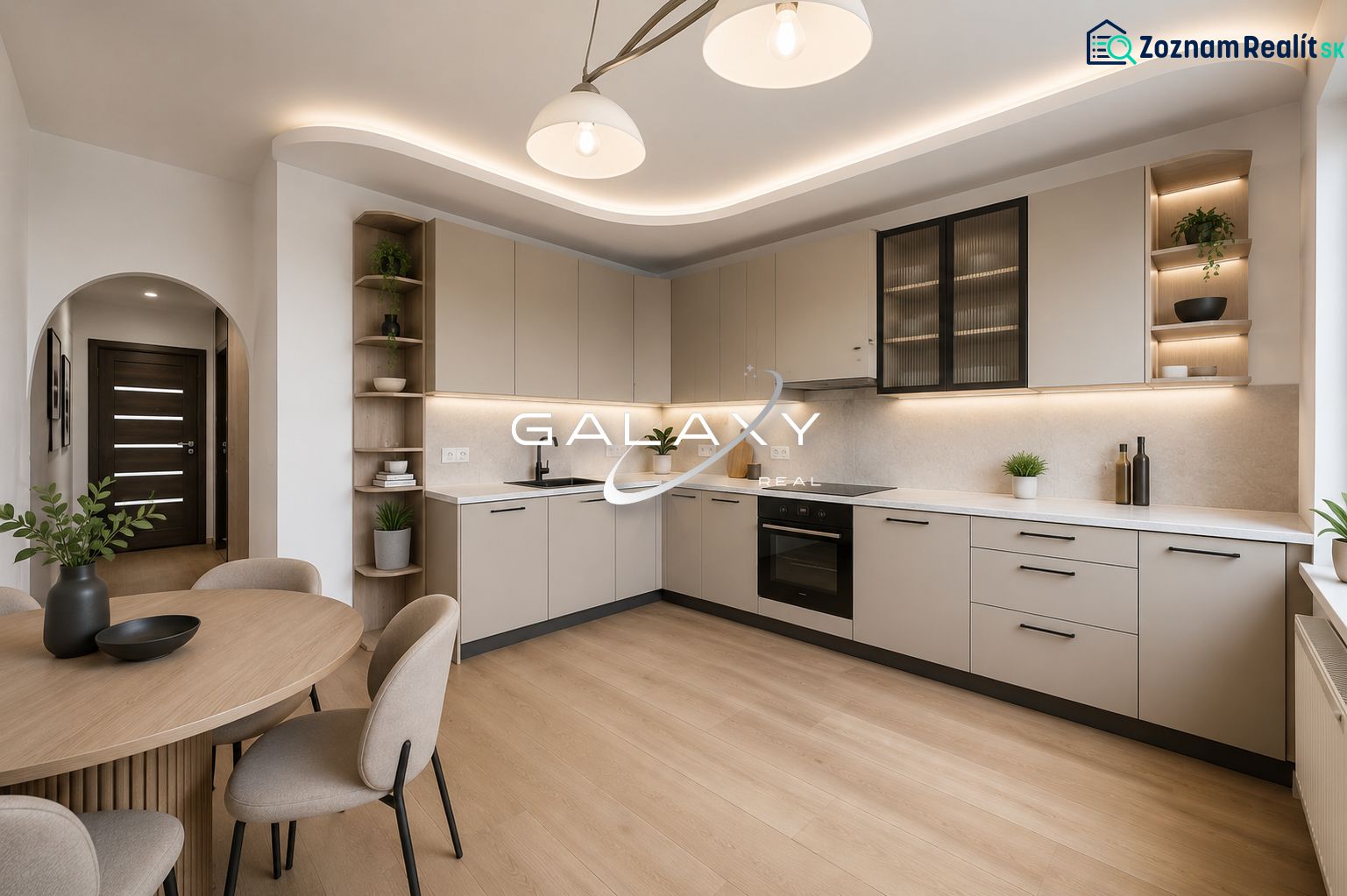 A kitchen in a 3-room apartment with a kitchen unit and a wooden decor floor.