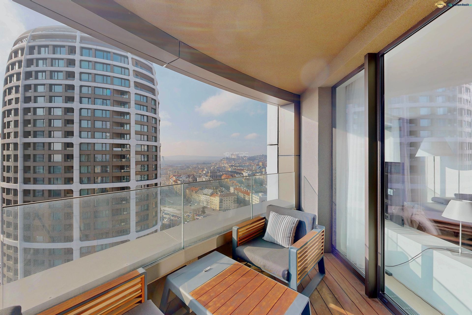 The balcony in the 3-room apartment offers a view of the panorama of the Old Town in Bratislava.