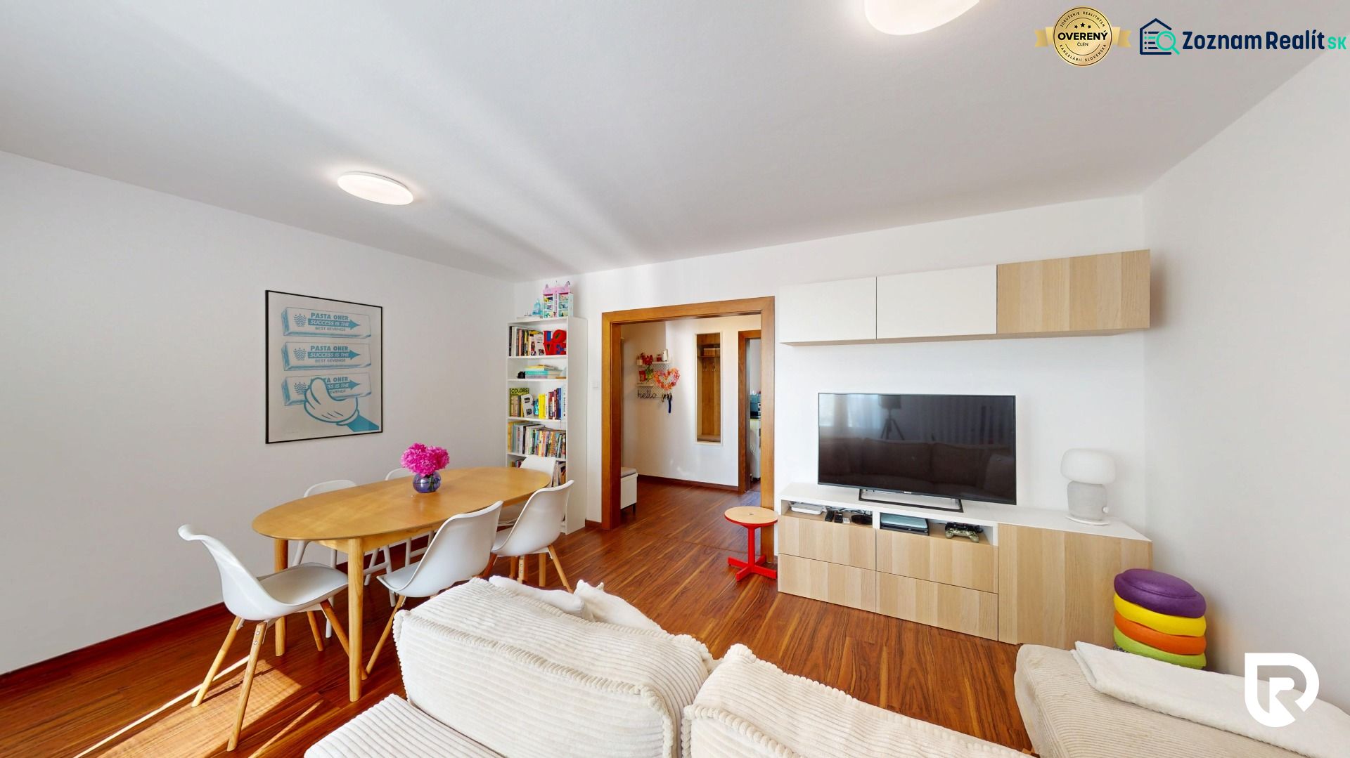 Living room with wooden decor, dining table, bookshelf, and TV cabinet.