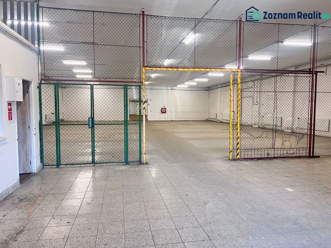 Interiors of warehouses and halls with tiling and metal fencing.