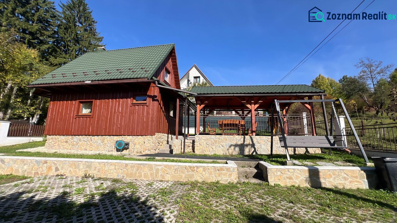A cottage in the village of Turík, Ružomberok district, Žilina region with a swing and a gazebo in the garden.