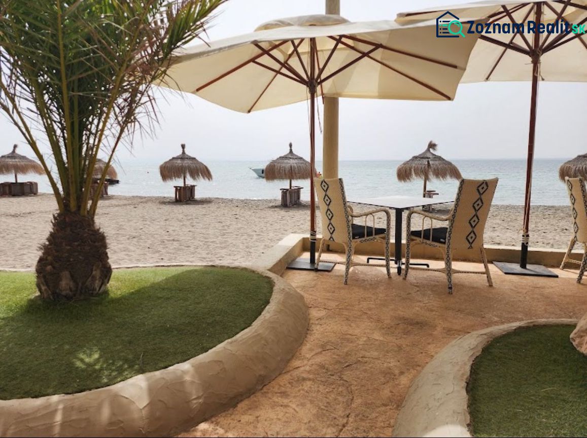 Beach terrace with sunbeds and umbrellas in La Manga del Mar Menor.