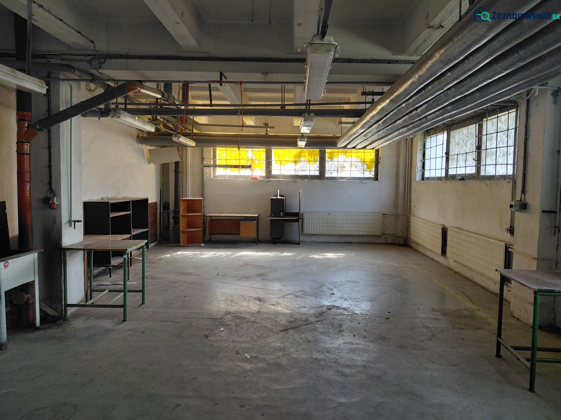 Industrial interior with pipes and old equipment in the warehouse and hall.