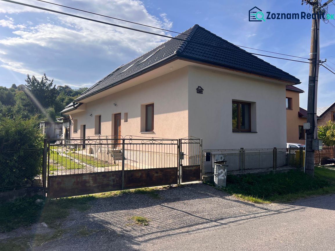 A family house on Krmeš Street in Liptovský Mikuláš with a front garden and a fence.