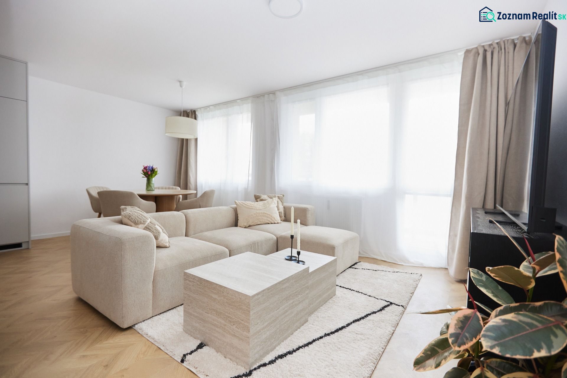 Living room with a comfortable sofa and a coffee table in a 4-room apartment.